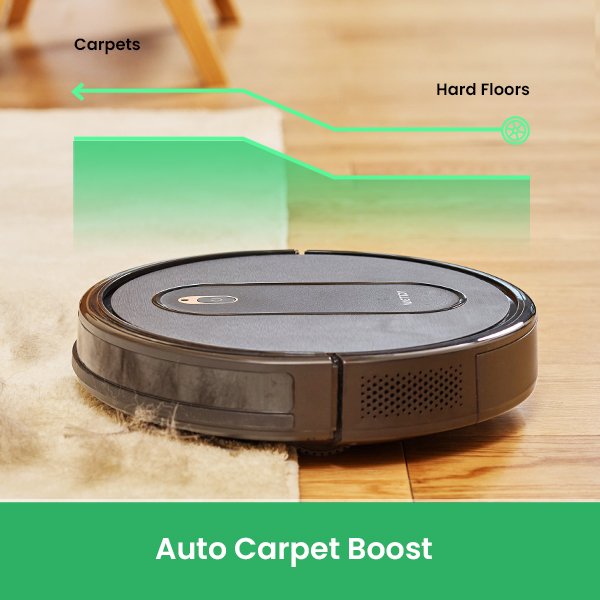 Robotic vacuum on carpet with automatic boost feature.