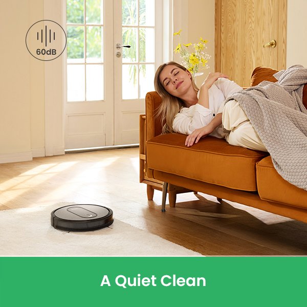 Woman relaxing while robot vacuum cleans quietly.